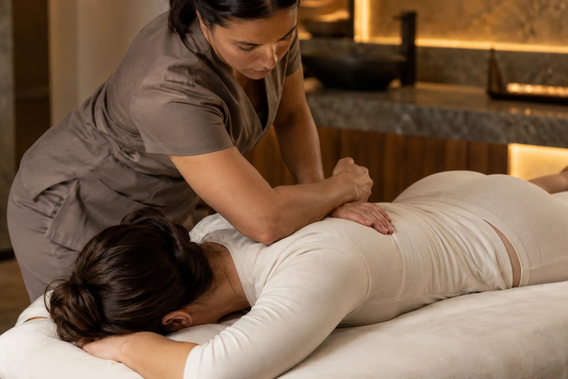 Step 3: Focused Deep Tissue Massage Therapist applying focused forearm pressure during a massage session.